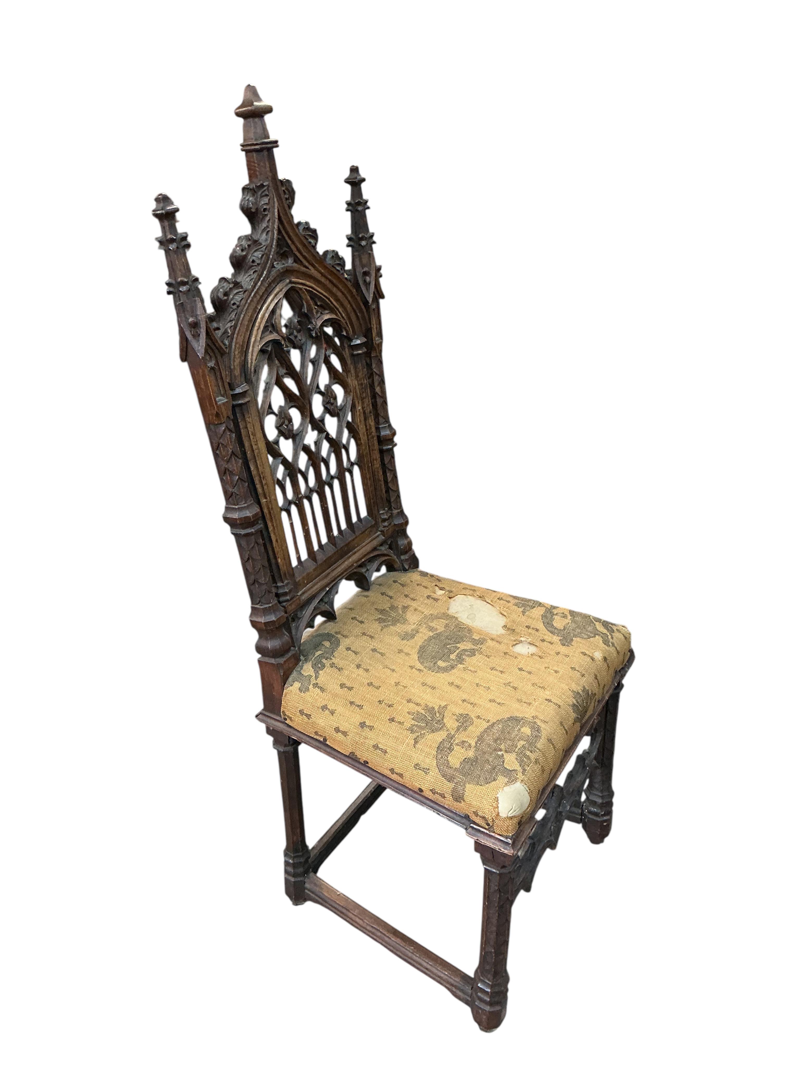 Attributed to Ferdinand Rothbart, a Victorian carved walnut Gothic Revival side chair, width 38cm, depth 41cm, height 113cm